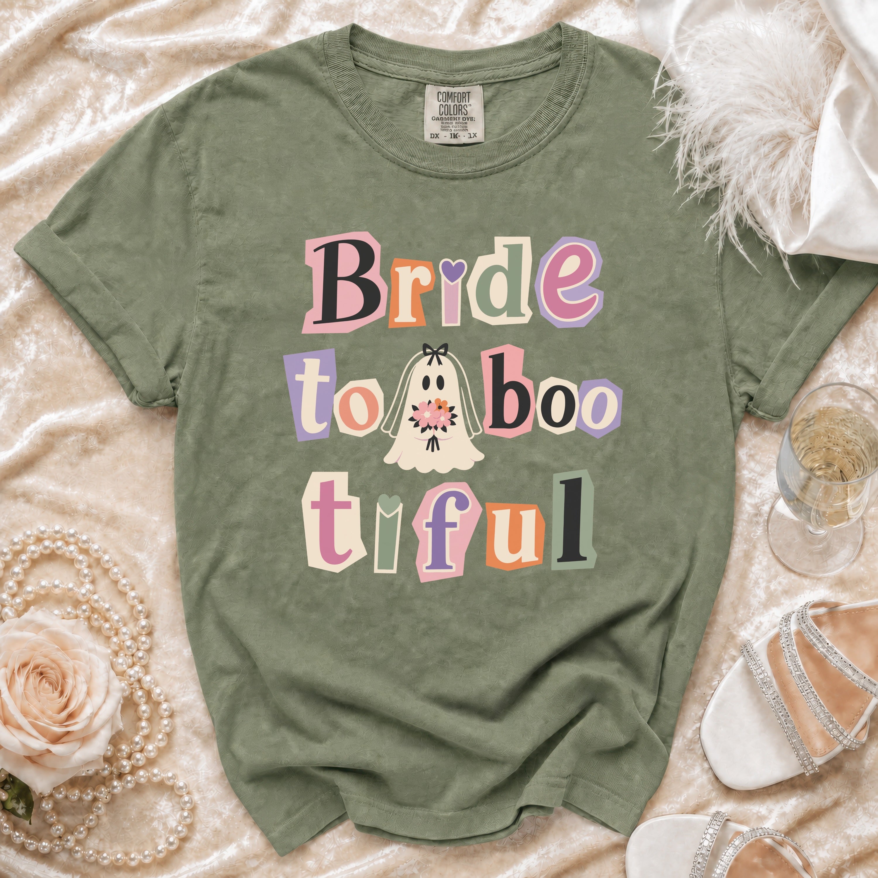Olive green t-shirt with "Bride to Boo-tiful" text and ghost graphic.