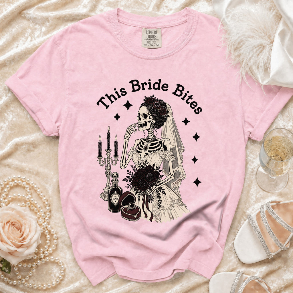 Pink t-shirt with skeleton bride graphic saying "This Bride Bites".