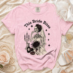 Pink t-shirt with skeleton bride graphic saying "This Bride Bites".
