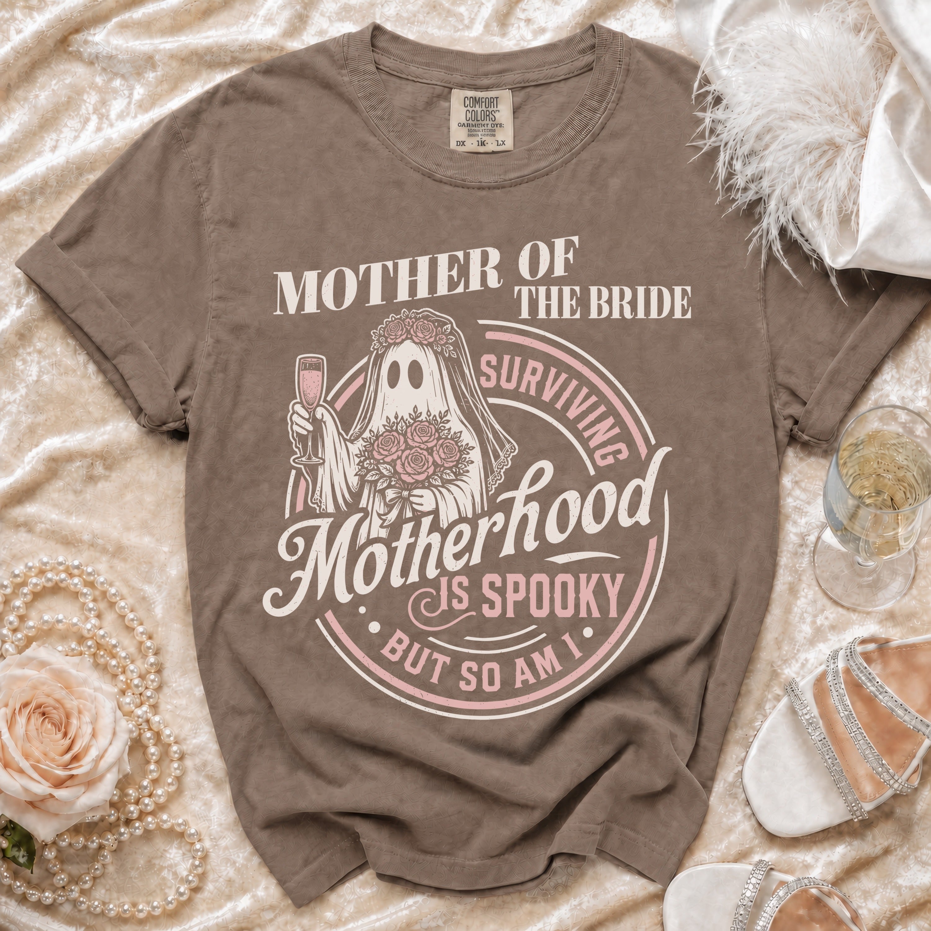 Brown t-shirt with "Mother of the Bride" ghost graphic saying "Motherhood is Spooky but so am I."