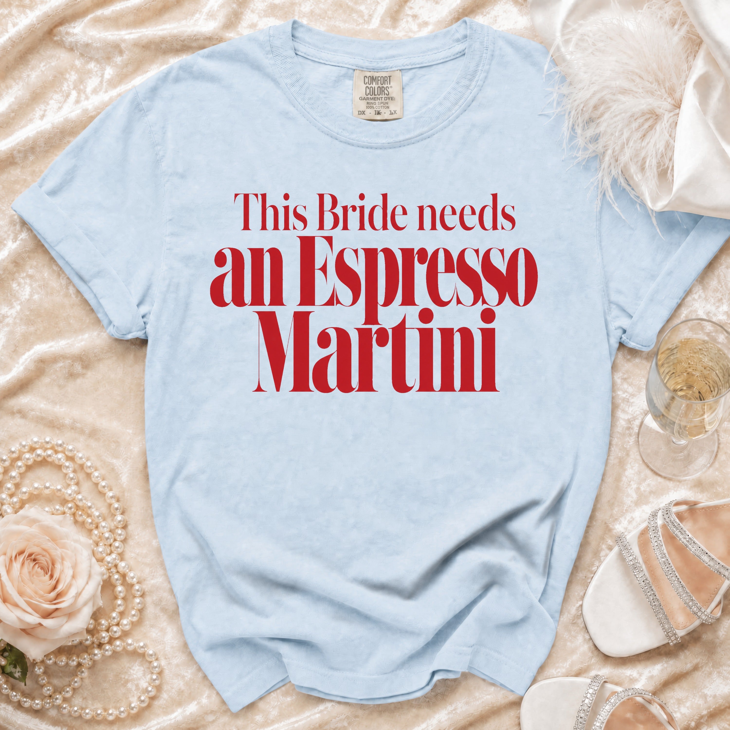 Light blue t-shirt with red text "This Bride needs an Espresso Martini."