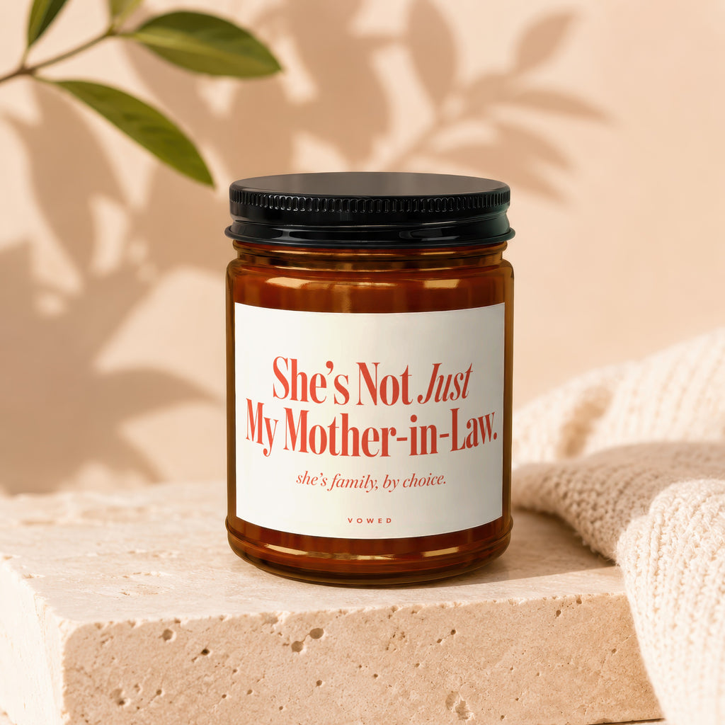 Candle with text "She's Not Just My Mother-in-Law. She's family, by choice. VOWED".