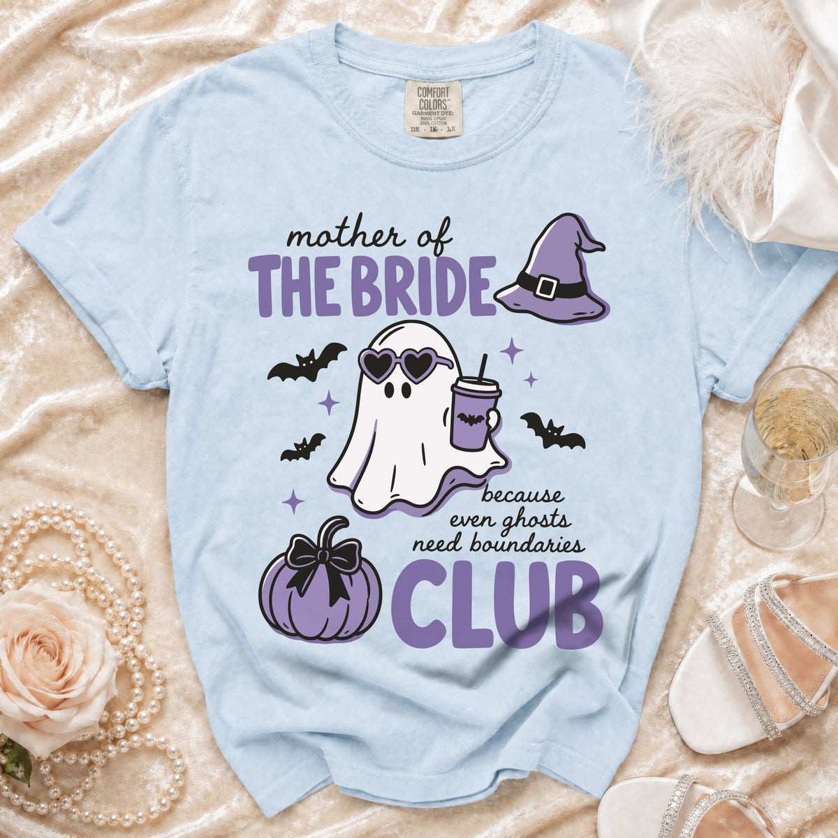 Light blue t-shirt with "Mother of the Bride" ghost graphic and text.