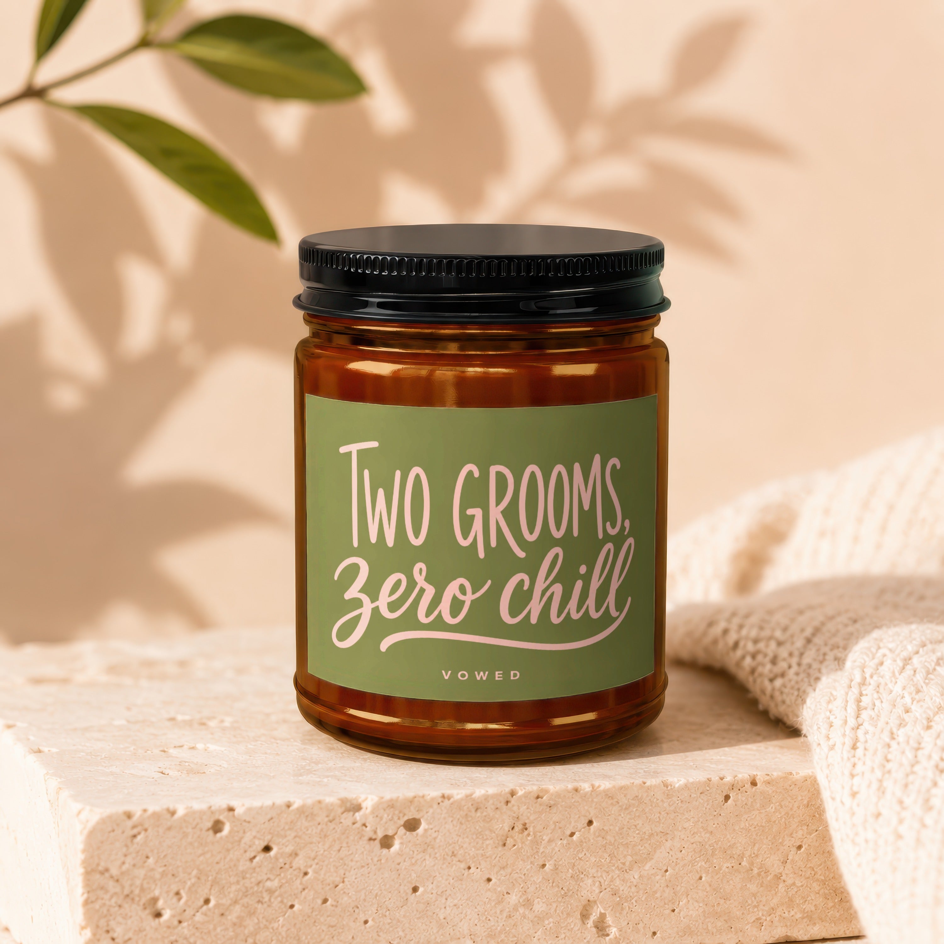 Amber candle with green label reading, "Two Grooms, Zero Chill"