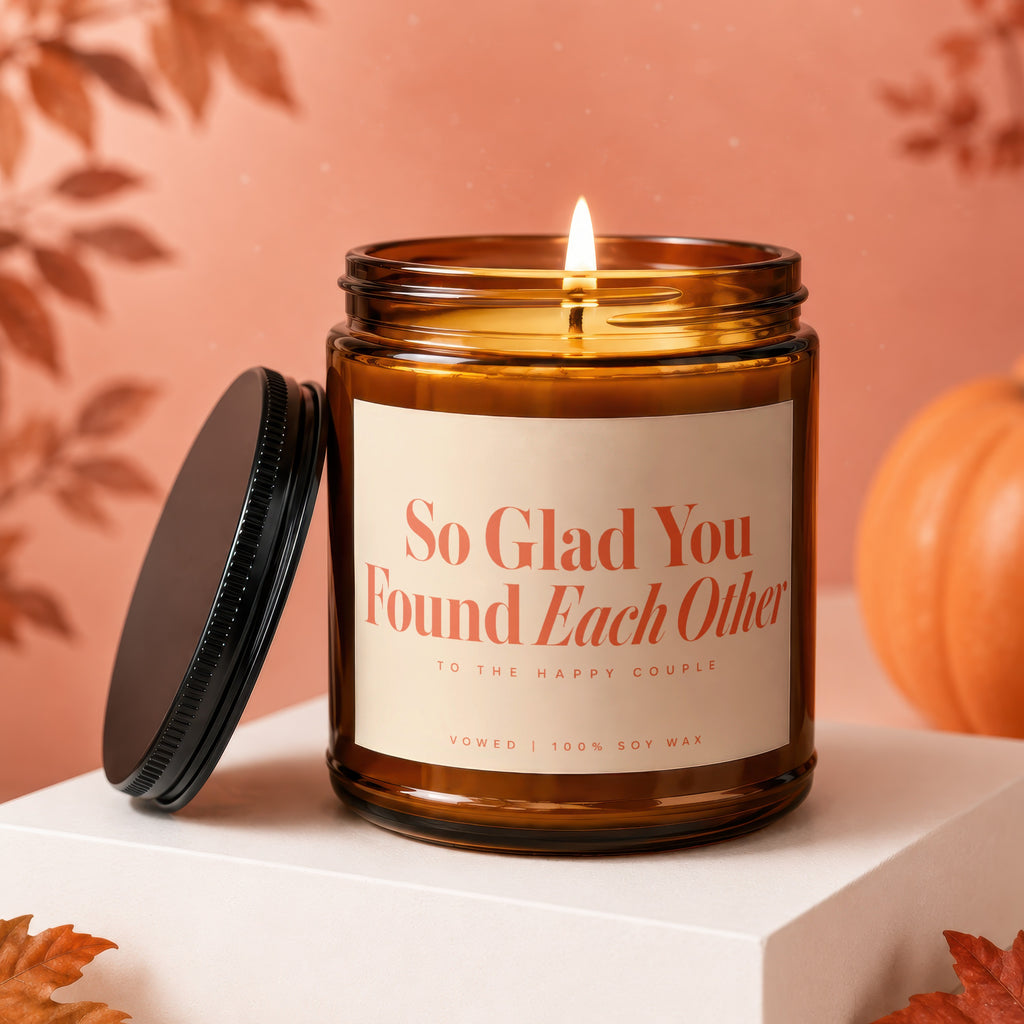 Amber jar candle with lit wick, "So Glad You Found Each Other" text, 100% soy wax.