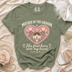 Green t-shirt with "Mother of the Groom His first home was my heart" text.