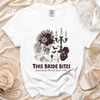 White t-shirt with "This Bride Bites" and gothic wedding graphics.
