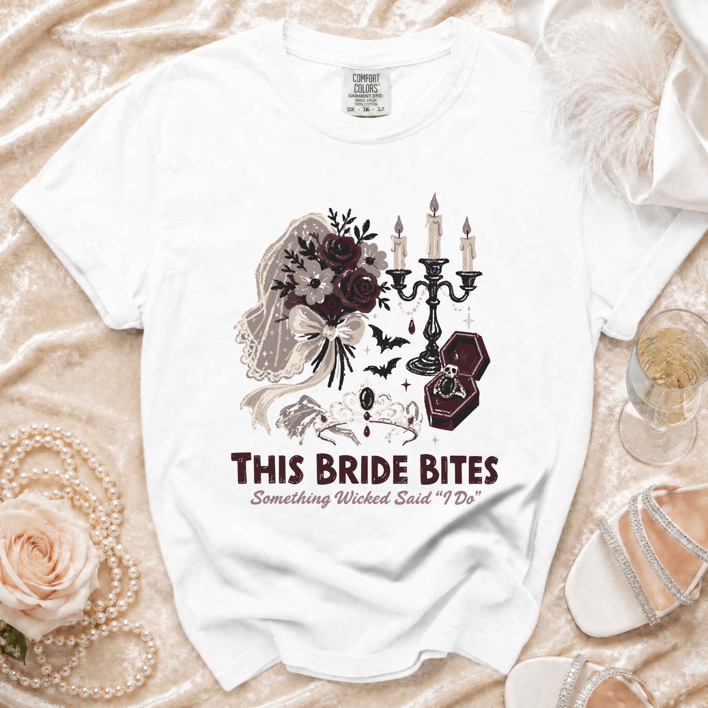 White t-shirt with "This Bride Bites" and gothic wedding graphics.