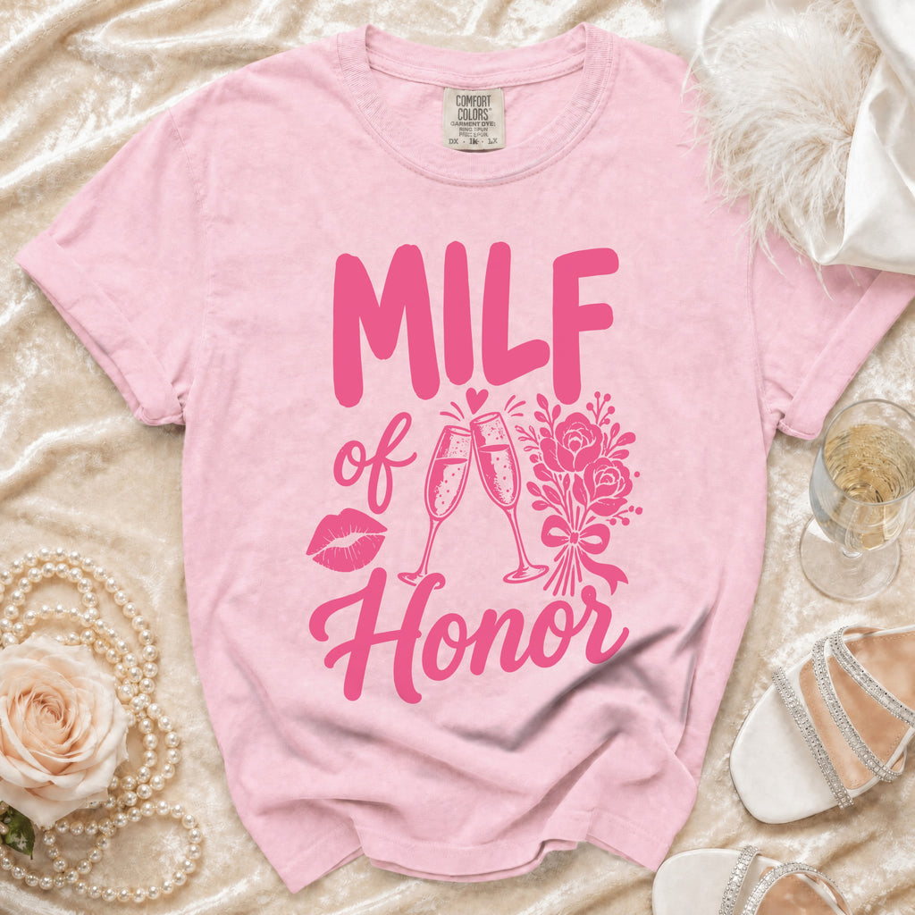 Pink t-shirt with pink "MILF of Honor" text, lips, champagne glasses, and flowers graphic.