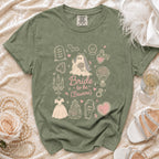 Olive green t-shirt with "Bride to be (Beware)" gothic-themed graphic.