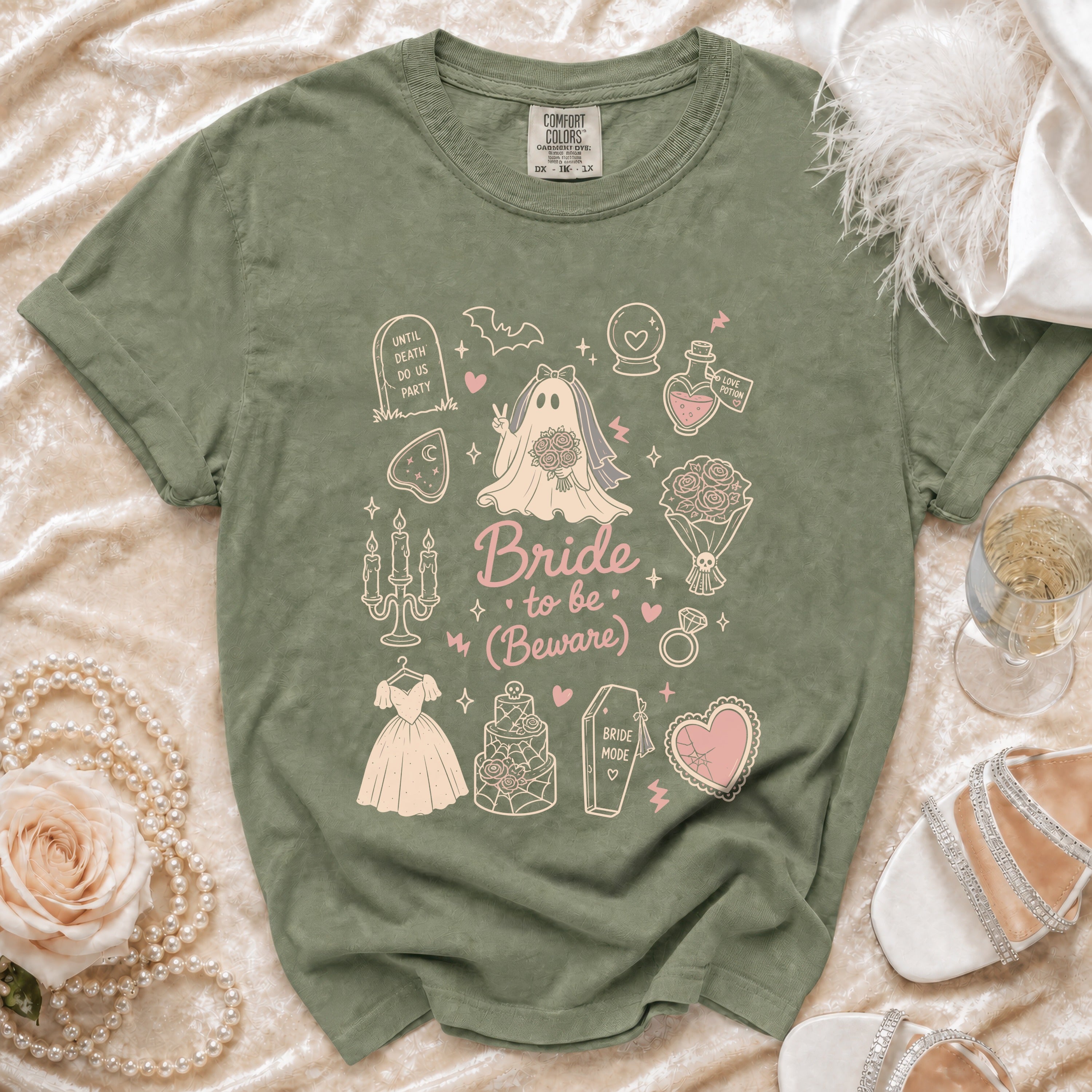 Olive green t-shirt with "Bride to be (Beware)" gothic-themed graphic.