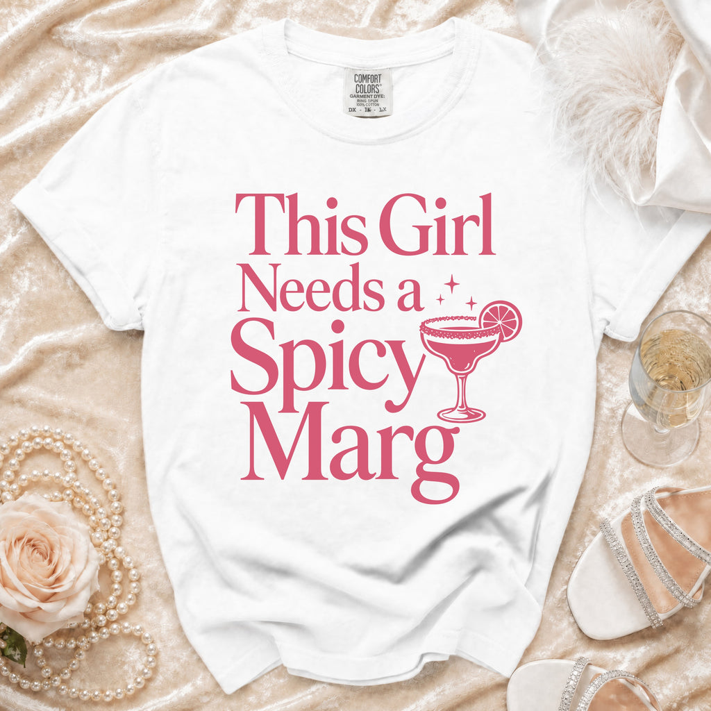 White t-shirt with pink text that says "This Girl Needs a Spicy Marg".