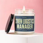 Jar candle titled "Coven Logistics Manager" with "Spreadsheets, Spells, Seating Charts" and "Vowed" on label.