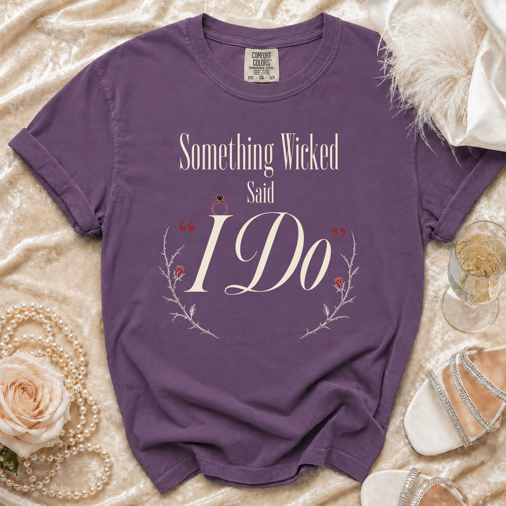 Purple t-shirt with "Something Wicked Said I Do" text and wedding ring graphic.