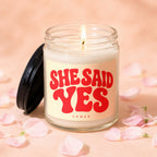 Glass candle with "She Said Yes" in red lettering and "Vowed" underneath.