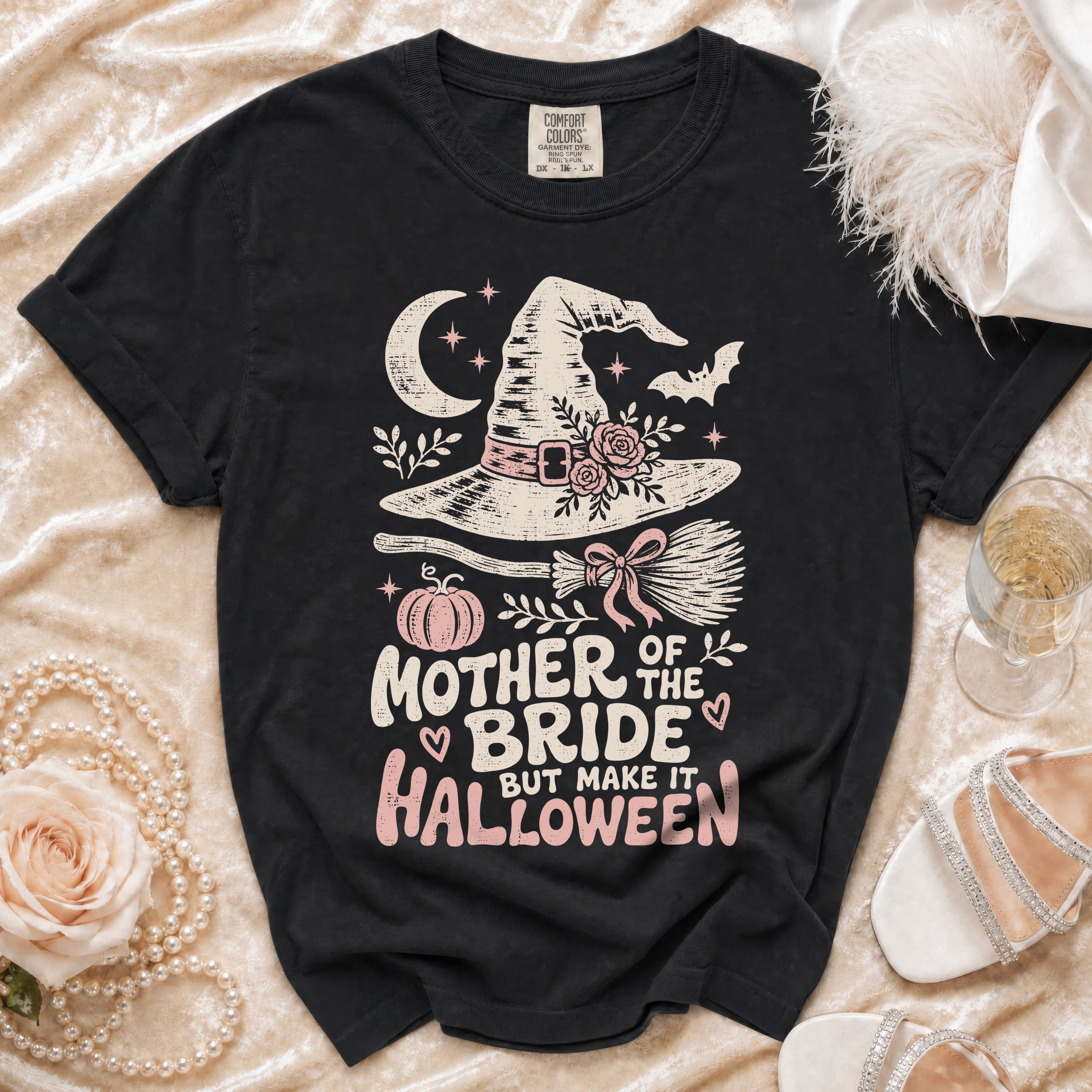 Black t-shirt with "Mother of the Bride But Make it Halloween" text and witchy graphics.