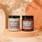 Two candles labeled "BRIDE TRIP! Bachelorette Weekend Loading VOWED".