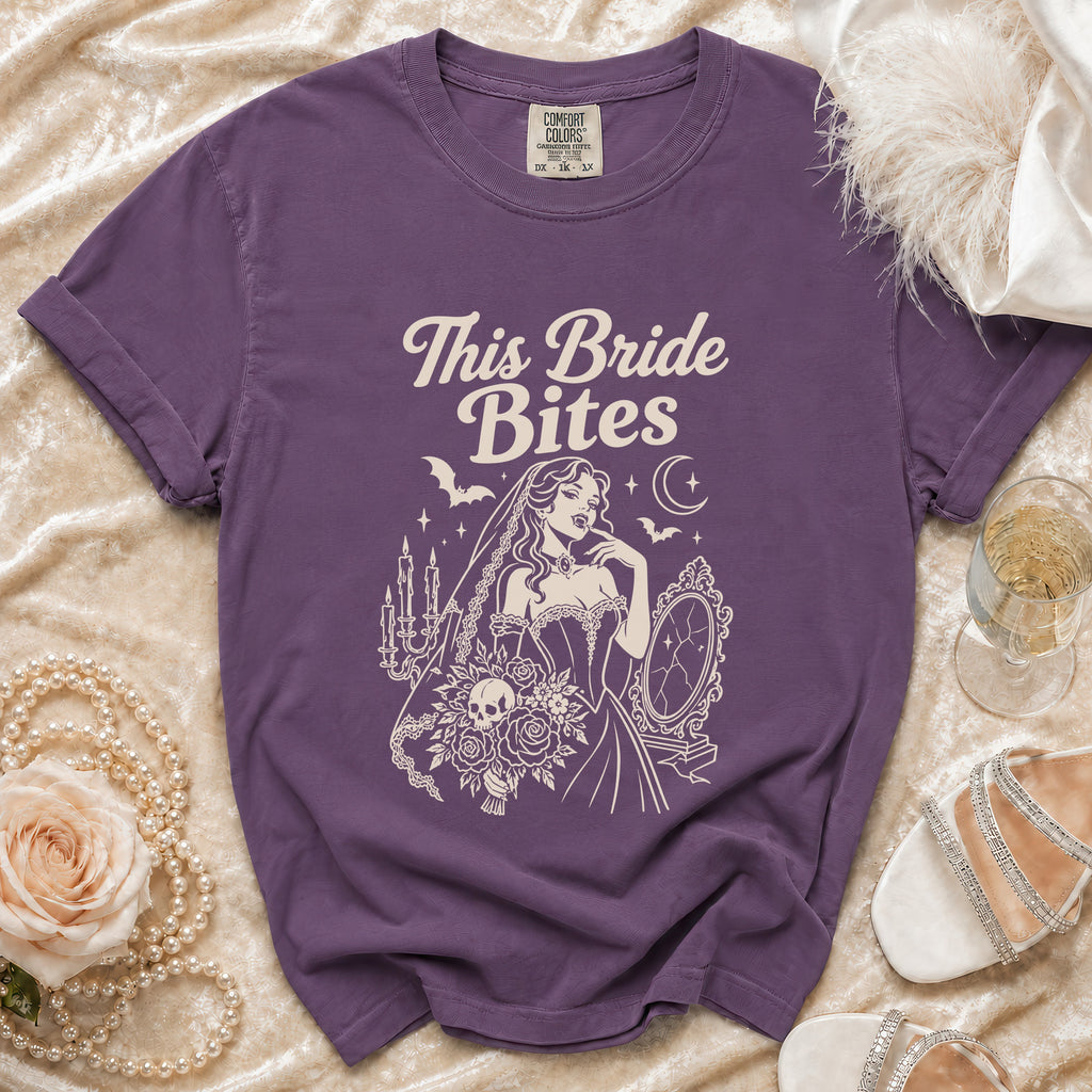 Purple t-shirt with "This Bride Bites" text and gothic bride graphic.