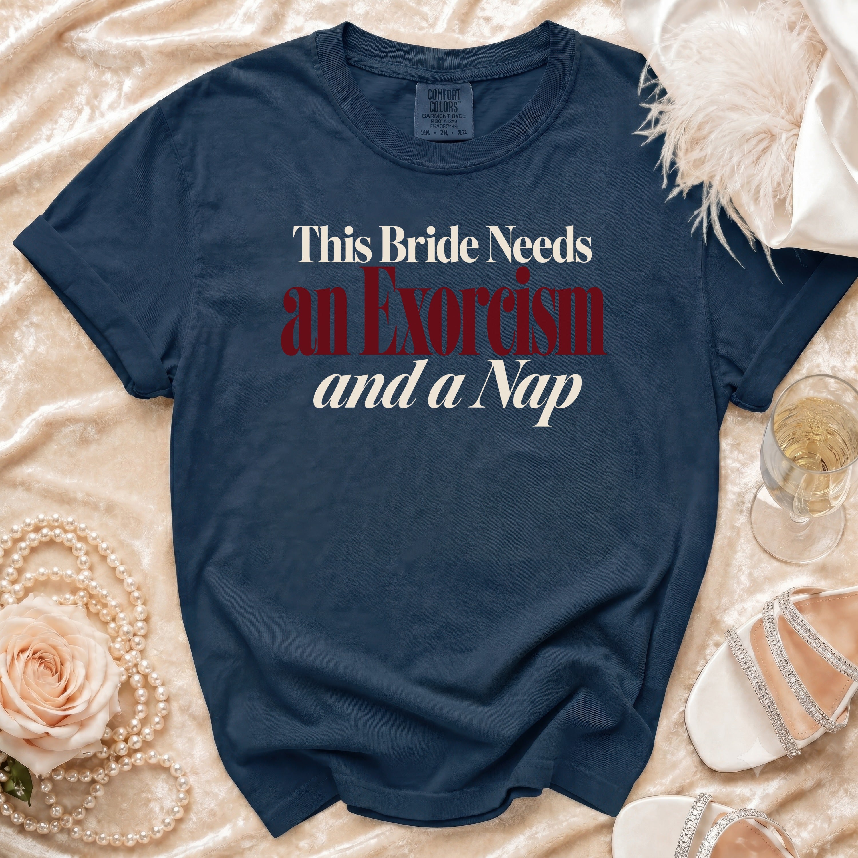 Navy t-shirt with "This Bride Needs an Exorcism and a Nap" text.