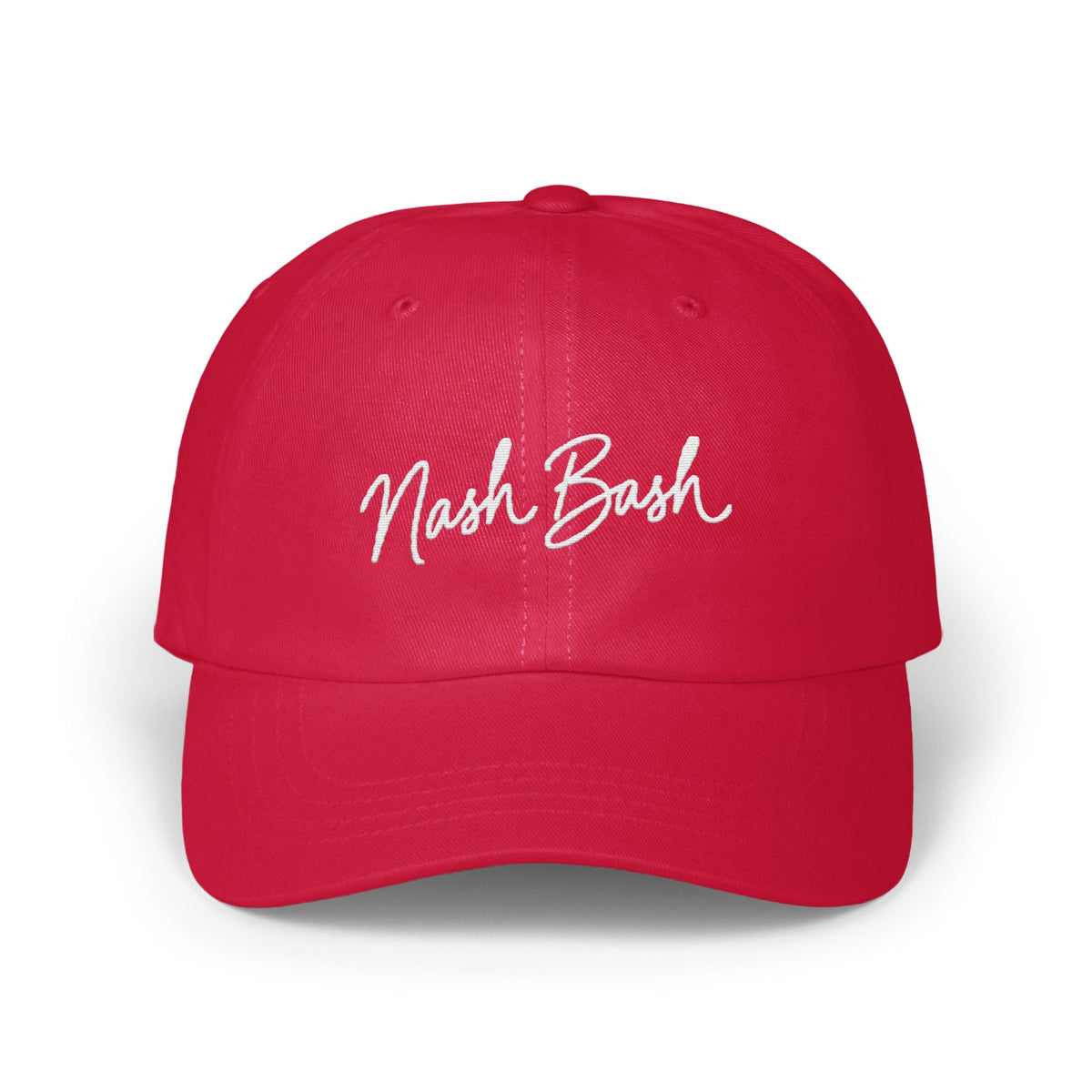 Red dad hat embroidered with white cursive text reading Nash Bash centered on the front panels.