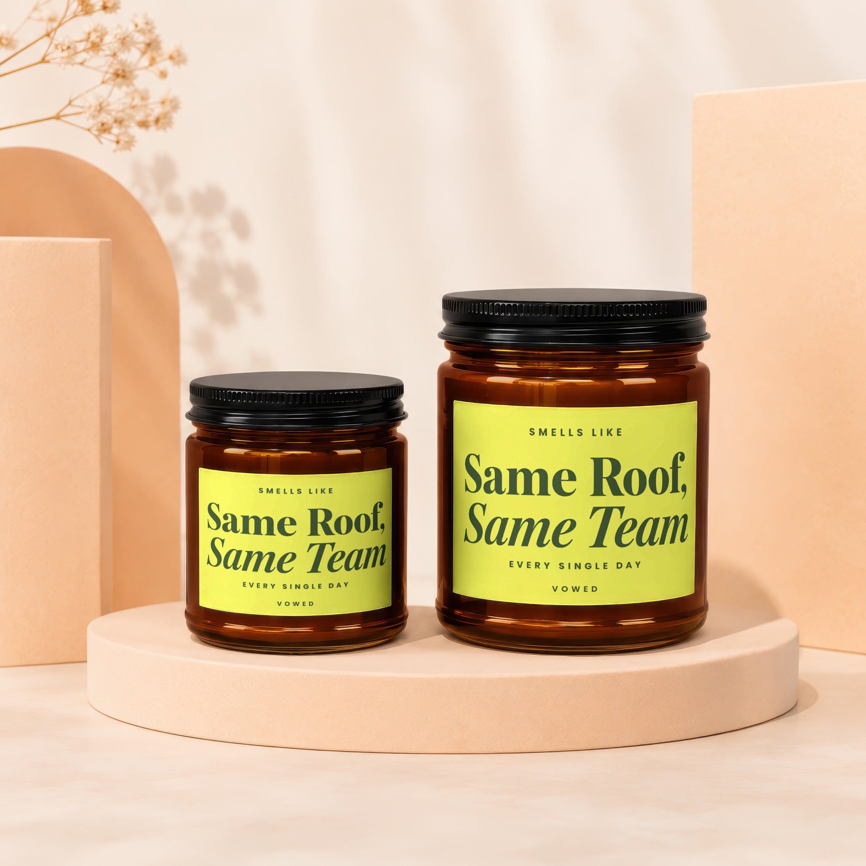 Two amber jars with black lids, labeled "Same Roof, Same Team."
