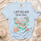 Light blue t-shirt with "Last Splash Sarah's Bach" and inflatable flamingos.