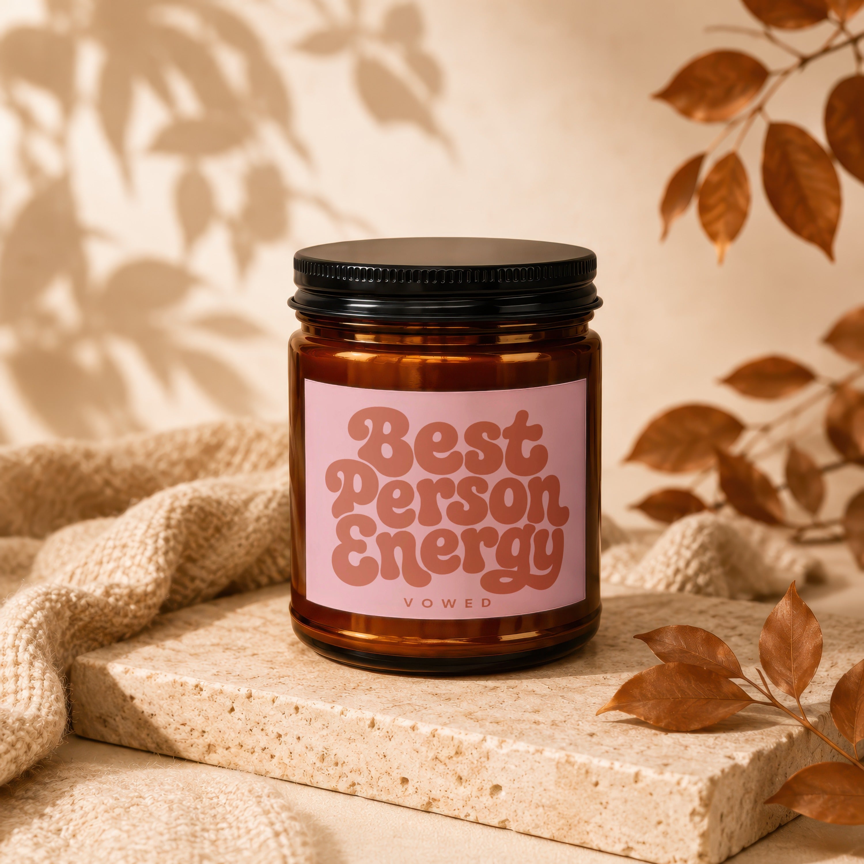 Amber jar candle with pink label saying "Best Person Energy" and "vowed".