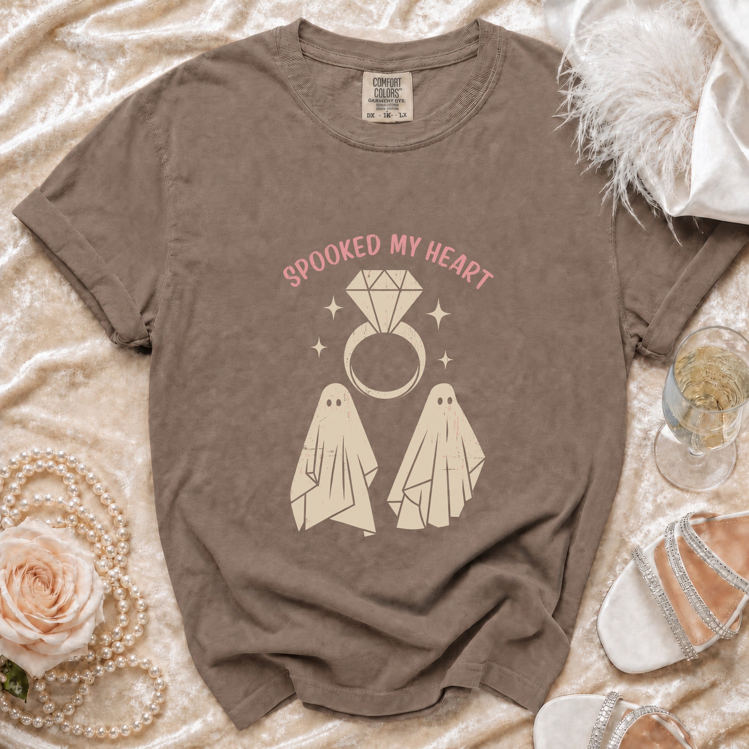 Brown t-shirt with "Spooked My Heart" text, diamond ring, and ghosts graphic.