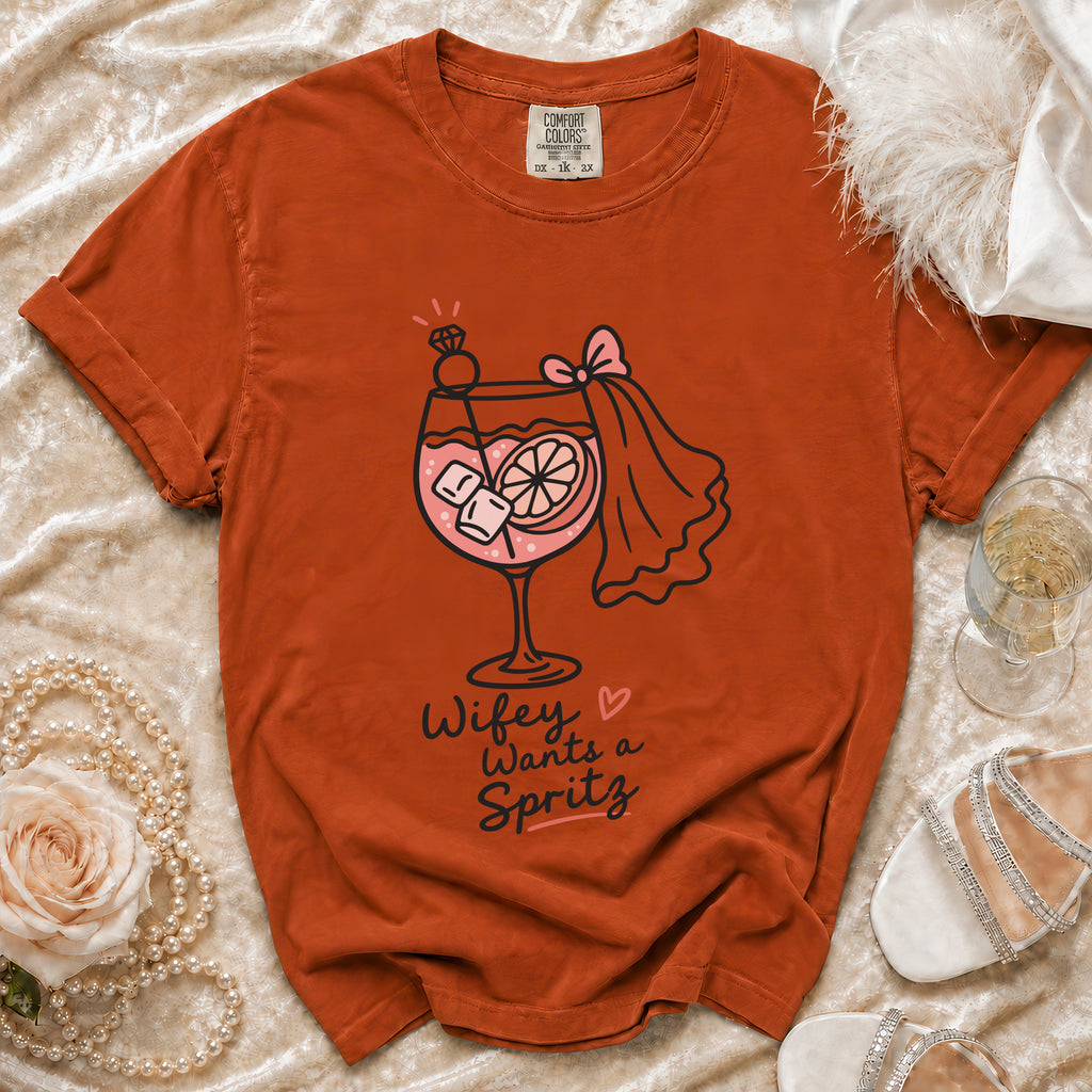 Orange t-shirt with "Wifey Wants a Spritz" graphic and martini glass.