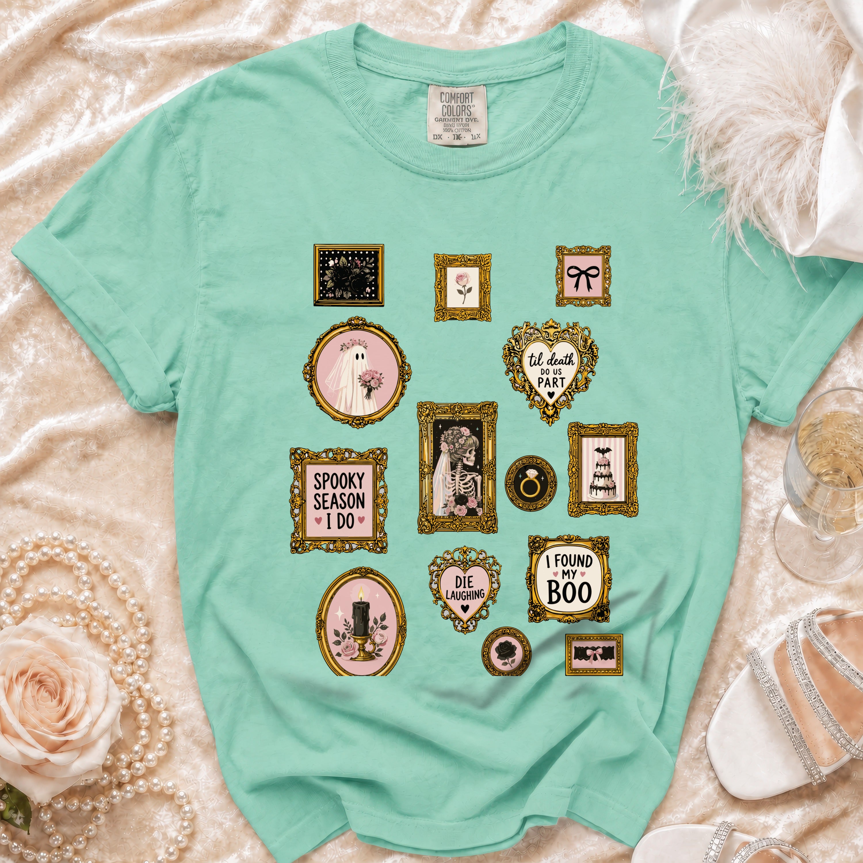 Mint green t-shirt with framed gothic and romantic wedding-themed graphics.