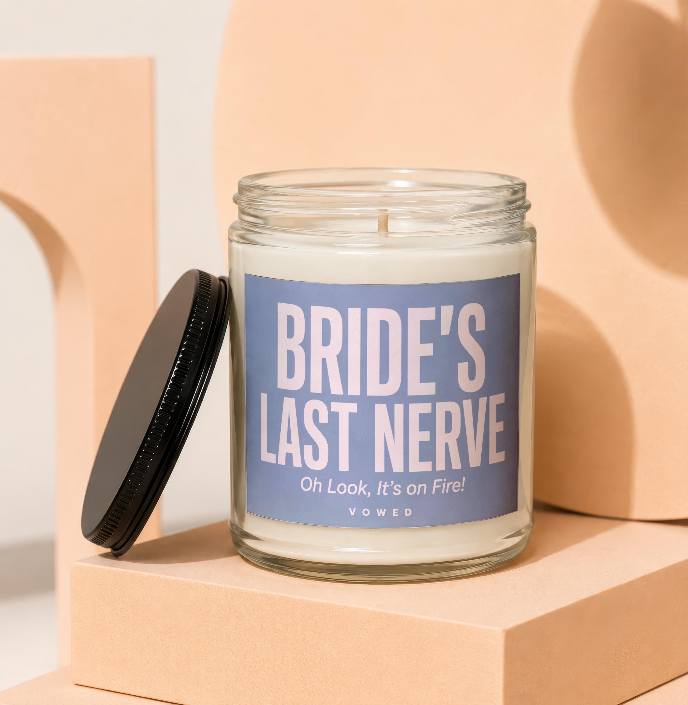Glass candle with "Bride's Last Nerve" and "Oh Look, It's on Fire!" on label.