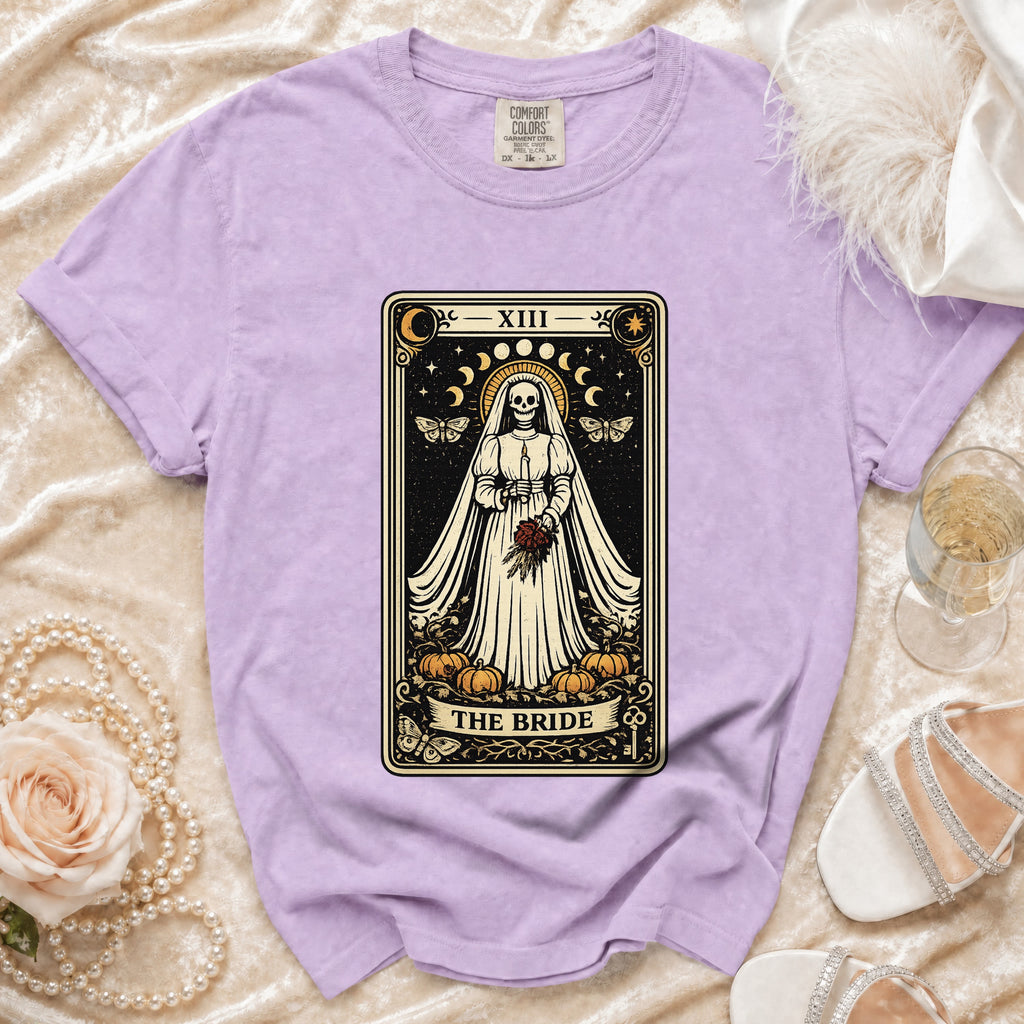 Purple t-shirt with "The Bride" tarot card graphic featuring a skeleton bride.