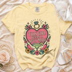 Yellow t-shirt with a graphic reading "This Girl Needs A Spicy Marg".