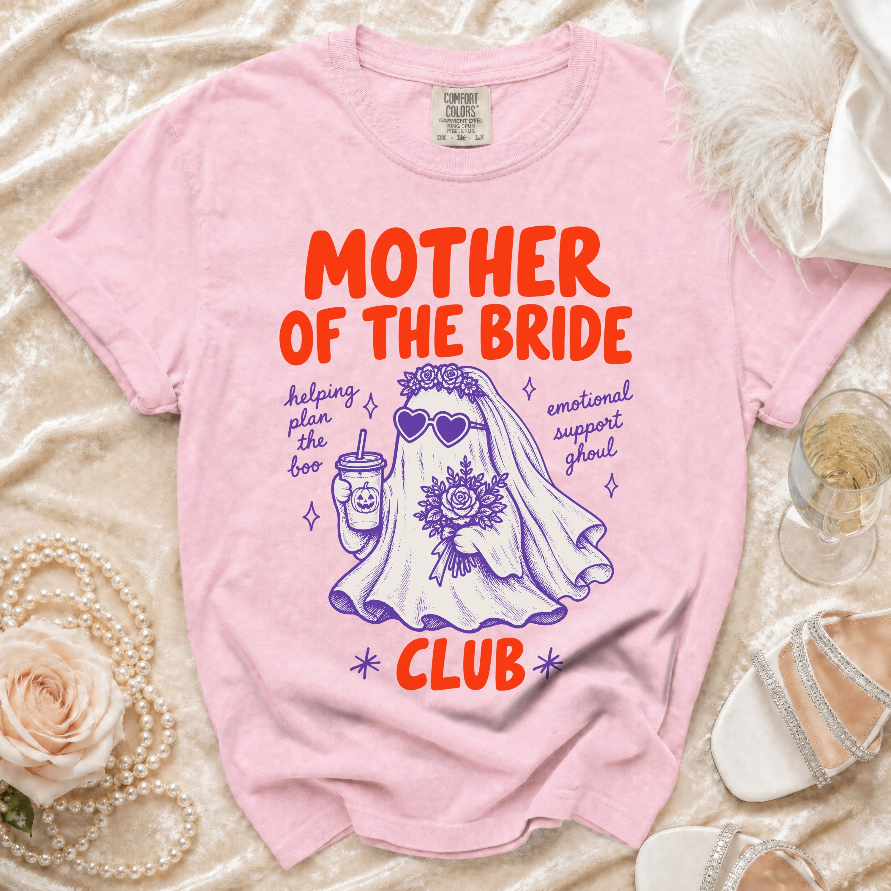 Pink t-shirt with "Mother of the Bride Club" text and a ghost graphic.