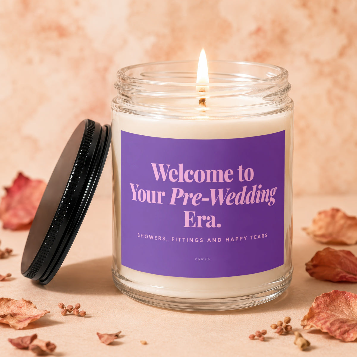 Glass candle with "Welcome to Your Pre-Wedding Era." text.