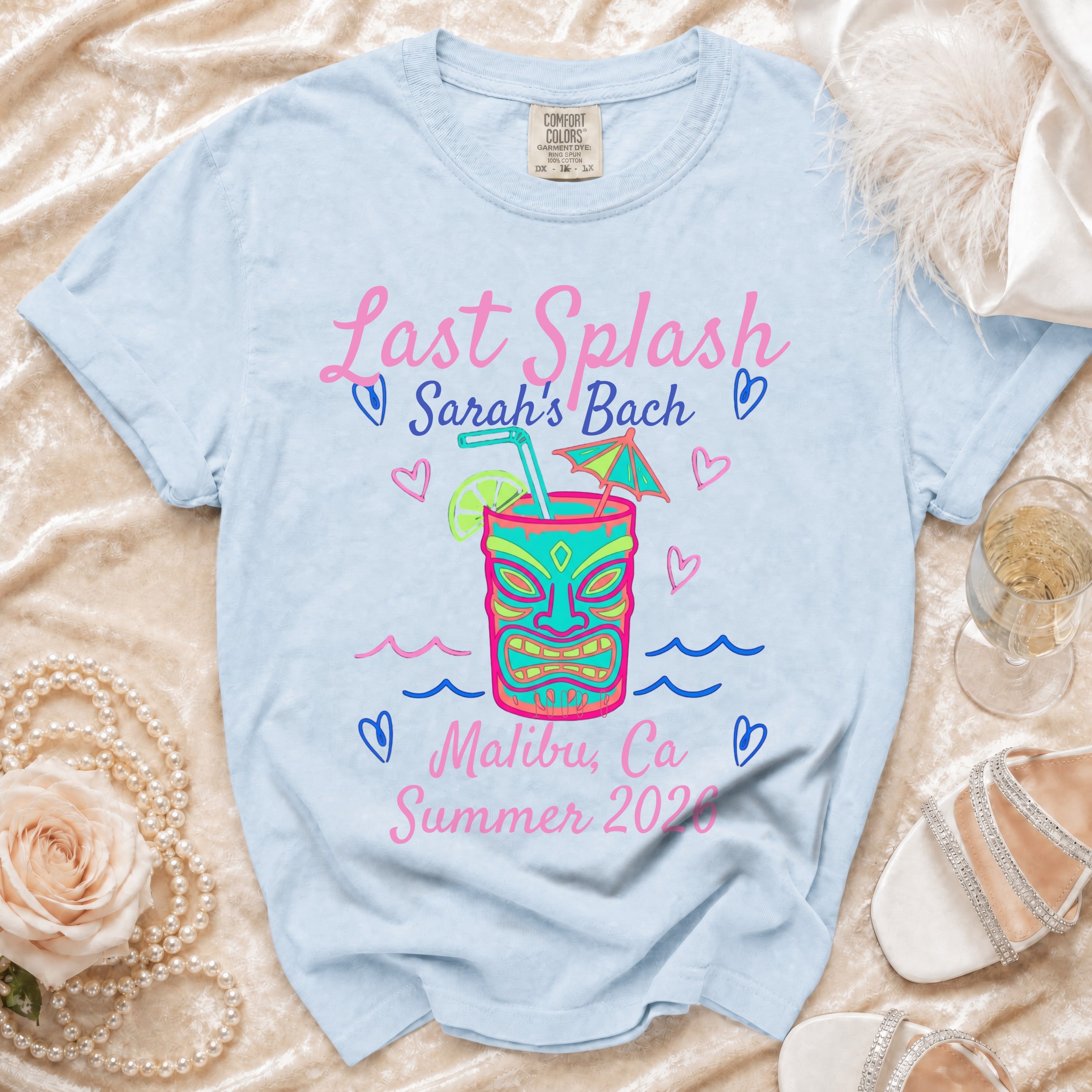 Light blue t-shirt with "Last Splash Sarah's Bach Malibu, Ca Summer 2020" text and tiki design.