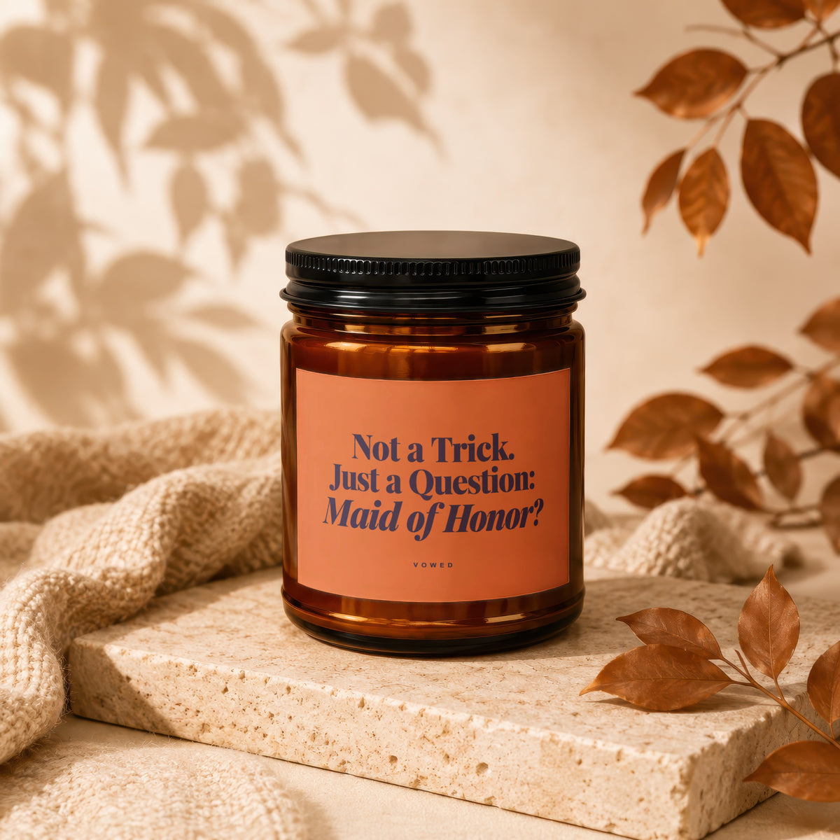 Amber jar candle with text "Not a Trick. Just a Question: Maid of Honor?"
