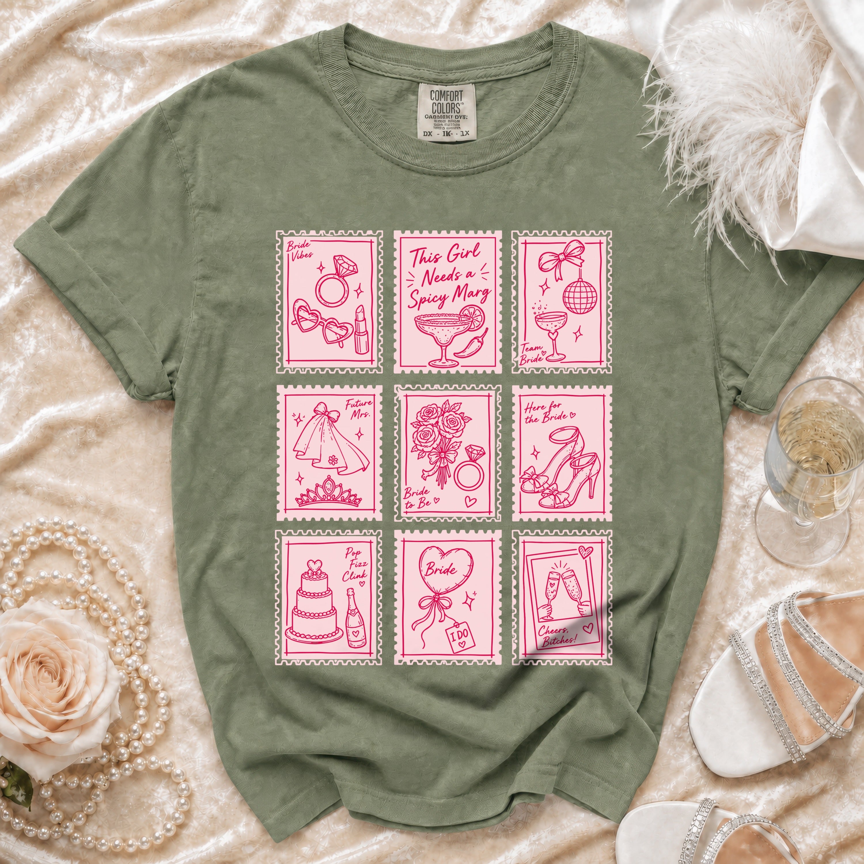 Green t-shirt with pink stamp designs of bridal items and sayings.