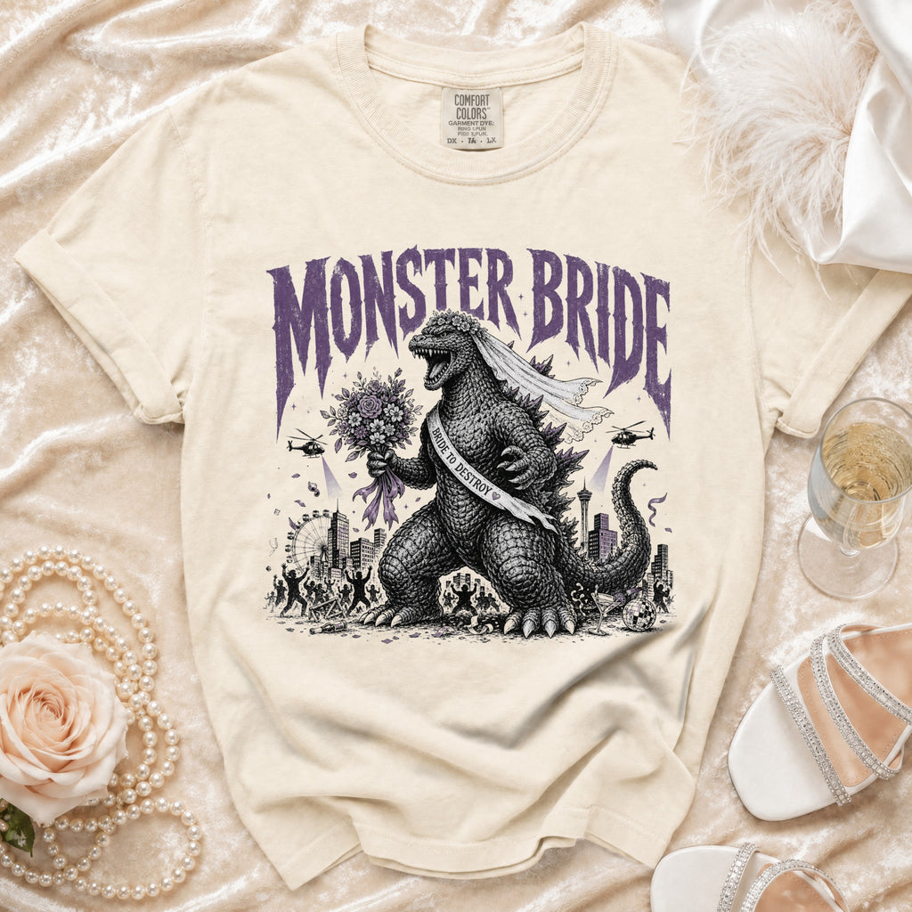 T-shirt with Godzilla as a bride, holding a bouquet, with text "MONSTER BRIDE".