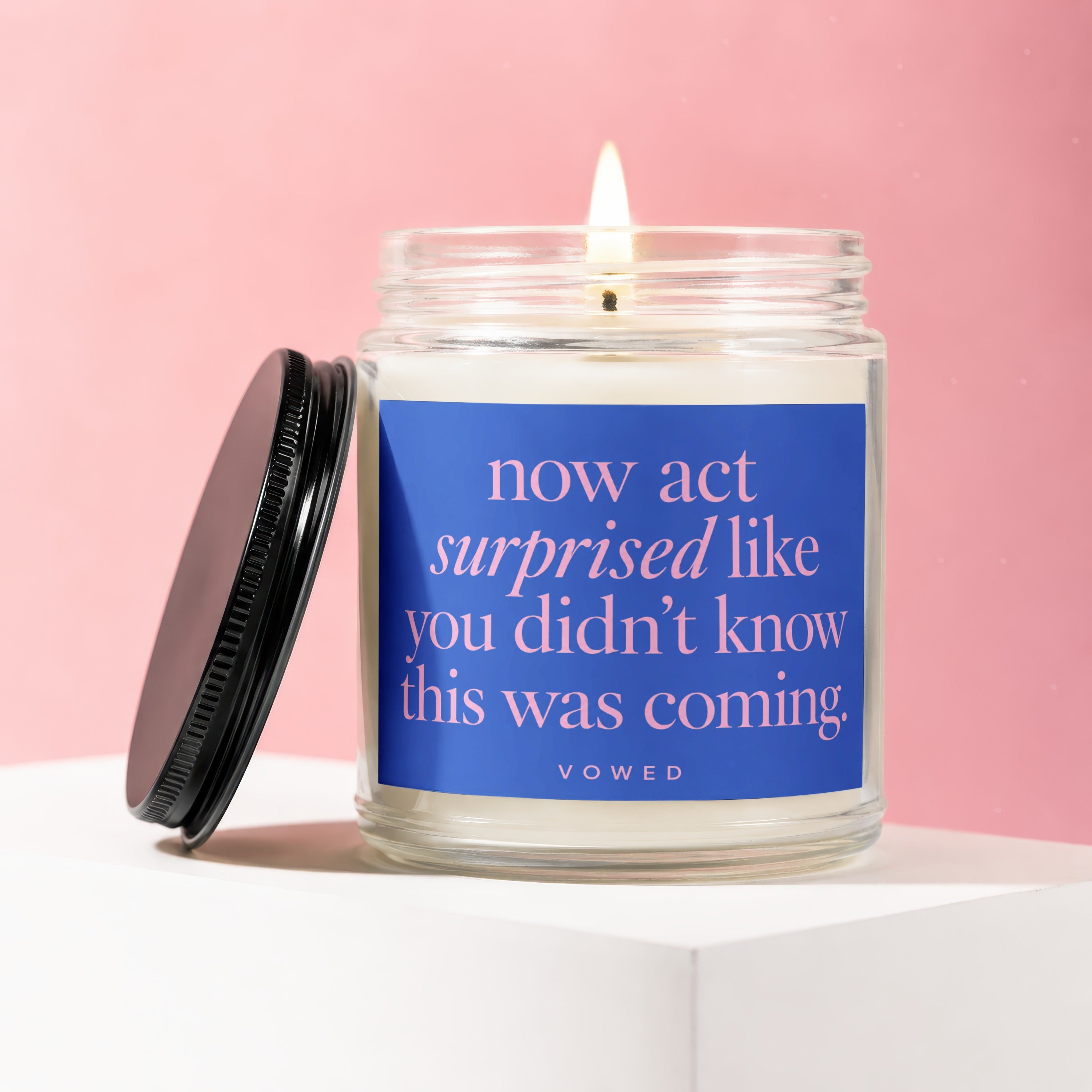 Candle with "now act surprised like you didn't know this was coming" text.