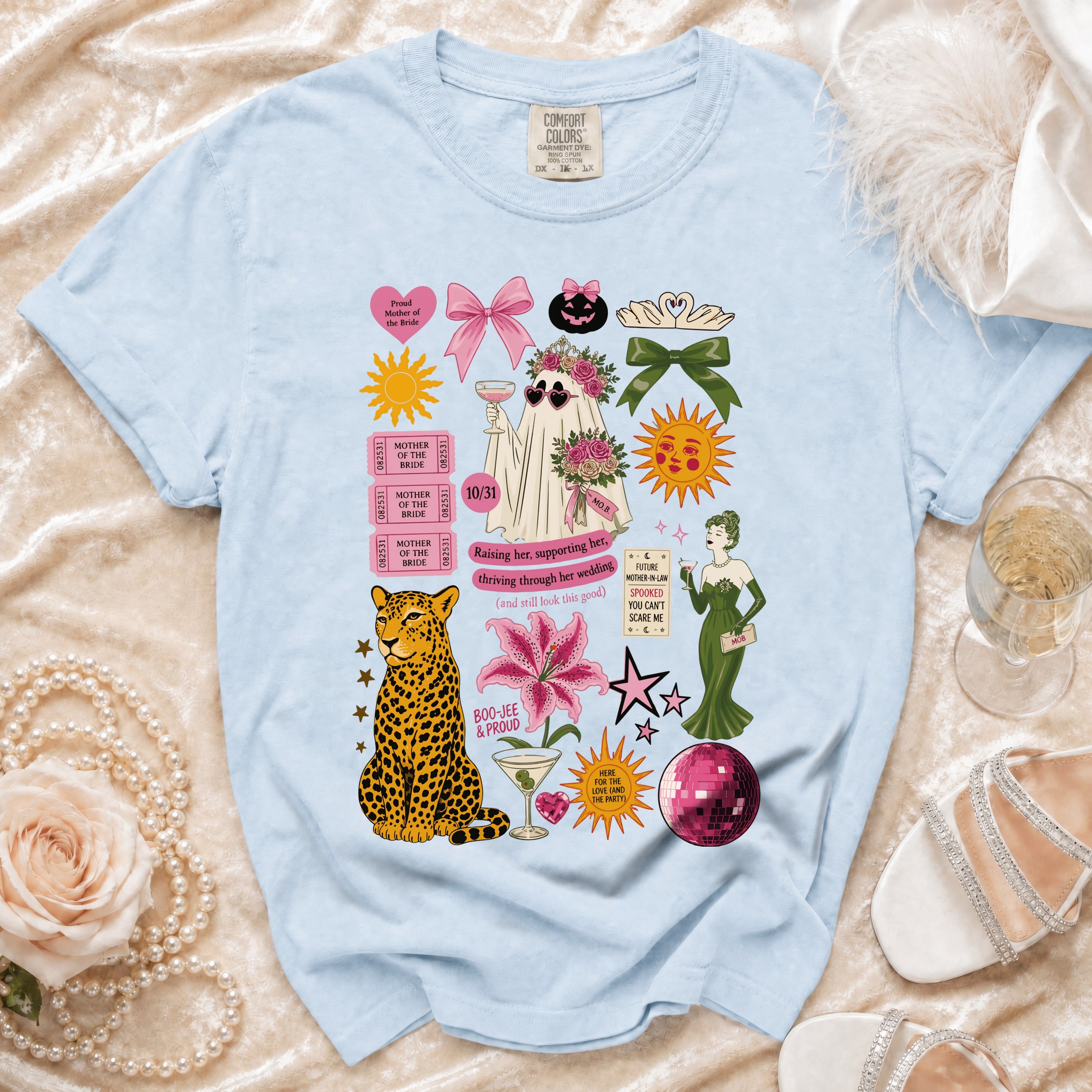 Light blue t-shirt with ghost bride, leopard, and wedding-themed graphics.