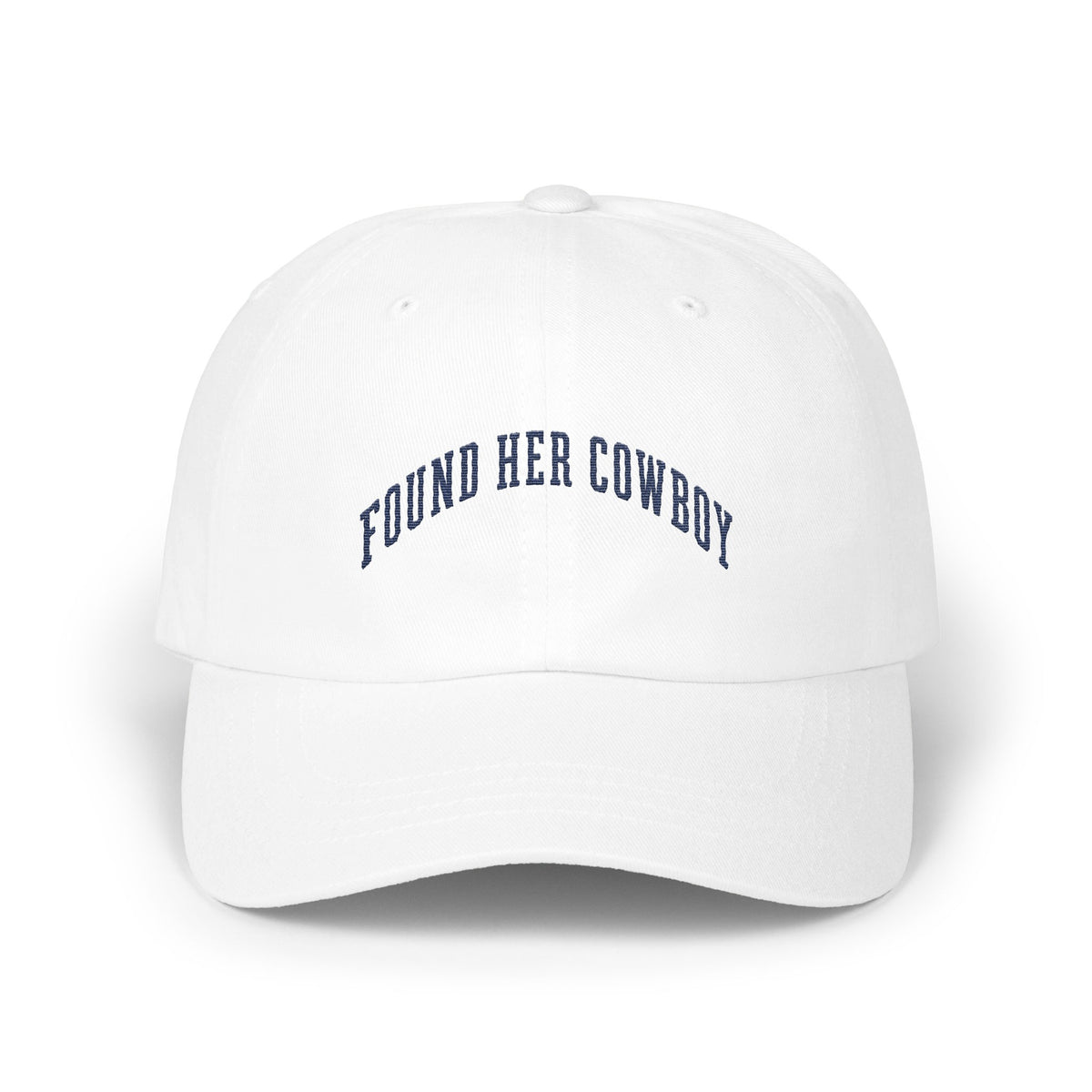 A white baseball cap with the curved blue embroidered text FOUND HER COWBOY.
