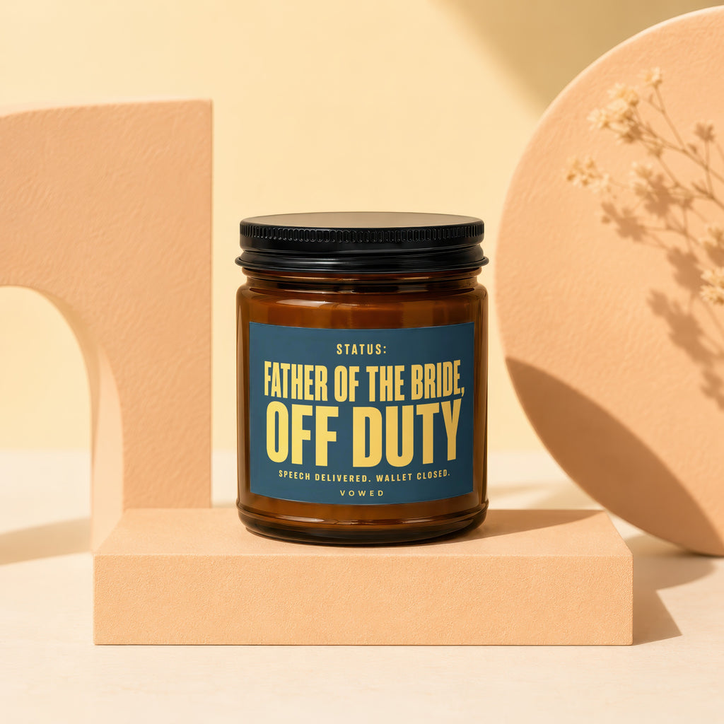 Amber jar candle with "Father of the Bride, Off Duty" text on label.