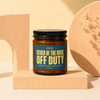 Amber jar candle with "Father of the Bride, Off Duty" text on label.