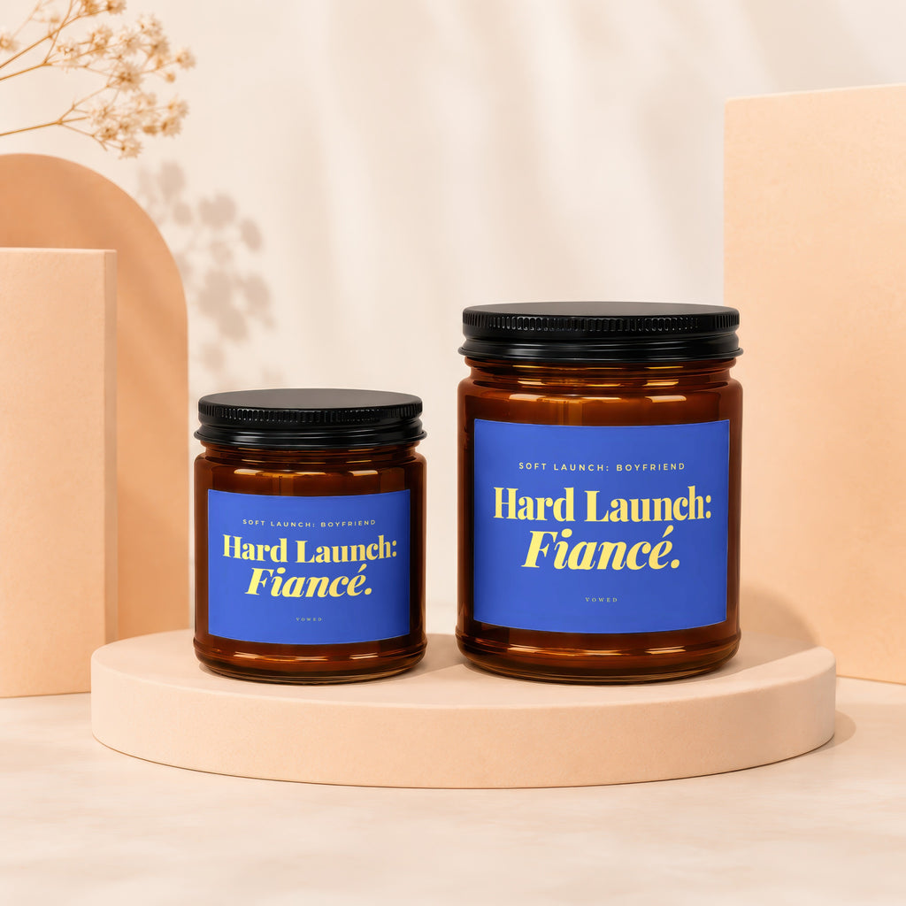 Two amber jars with blue labels reading "Hard Launch: Fiancé." and "Hard Launch: Boyfriend."