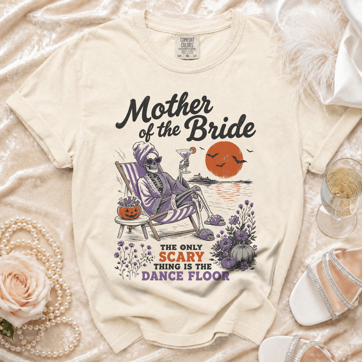 Cream t-shirt with "Mother of the Bride" and skeleton graphic.