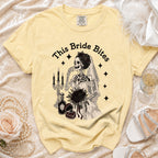 Yellow t-shirt with skeleton bride graphic and text "This Bride Bites".
