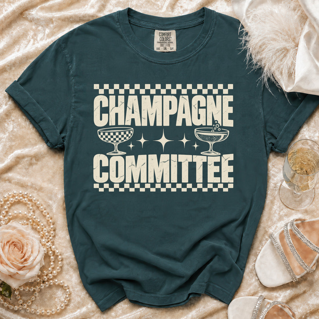 Teal t-shirt with "Champagne Committee" text and champagne glasses.