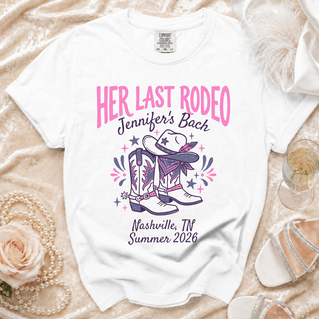 White t-shirt with "HER LAST RODEO" and Western-themed graphics.