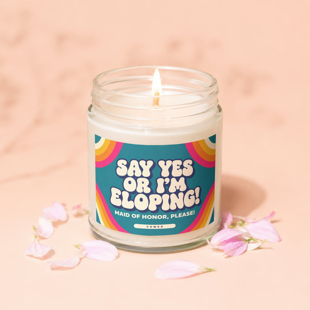 Jar candle with lit wick, reads "Say Yes or I'm Eloping! Maid of Honor, Please!"